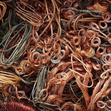 Tangled copper wires piled together.