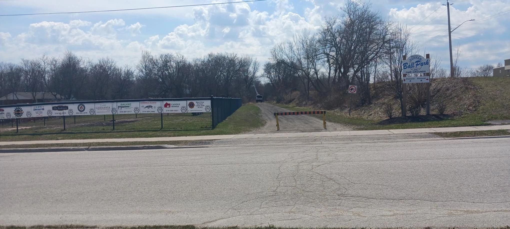 Entrance to Durham ball park with fencing and signs