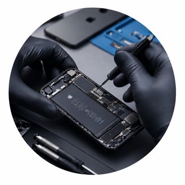 Repairing an iPhone with precision tools.
