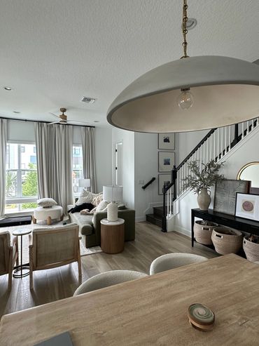 Modern living room with neutral tones and natural light.
