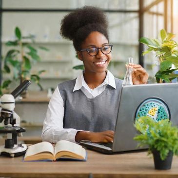 A young person studying science online. 