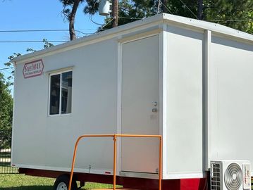 A white portable trailer with a small window and door, labeled 'Smith A1'.