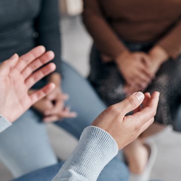 A group of people having a therapy session