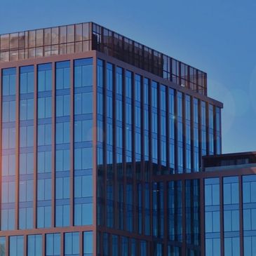 Commercial high-rise building reflecting the sun