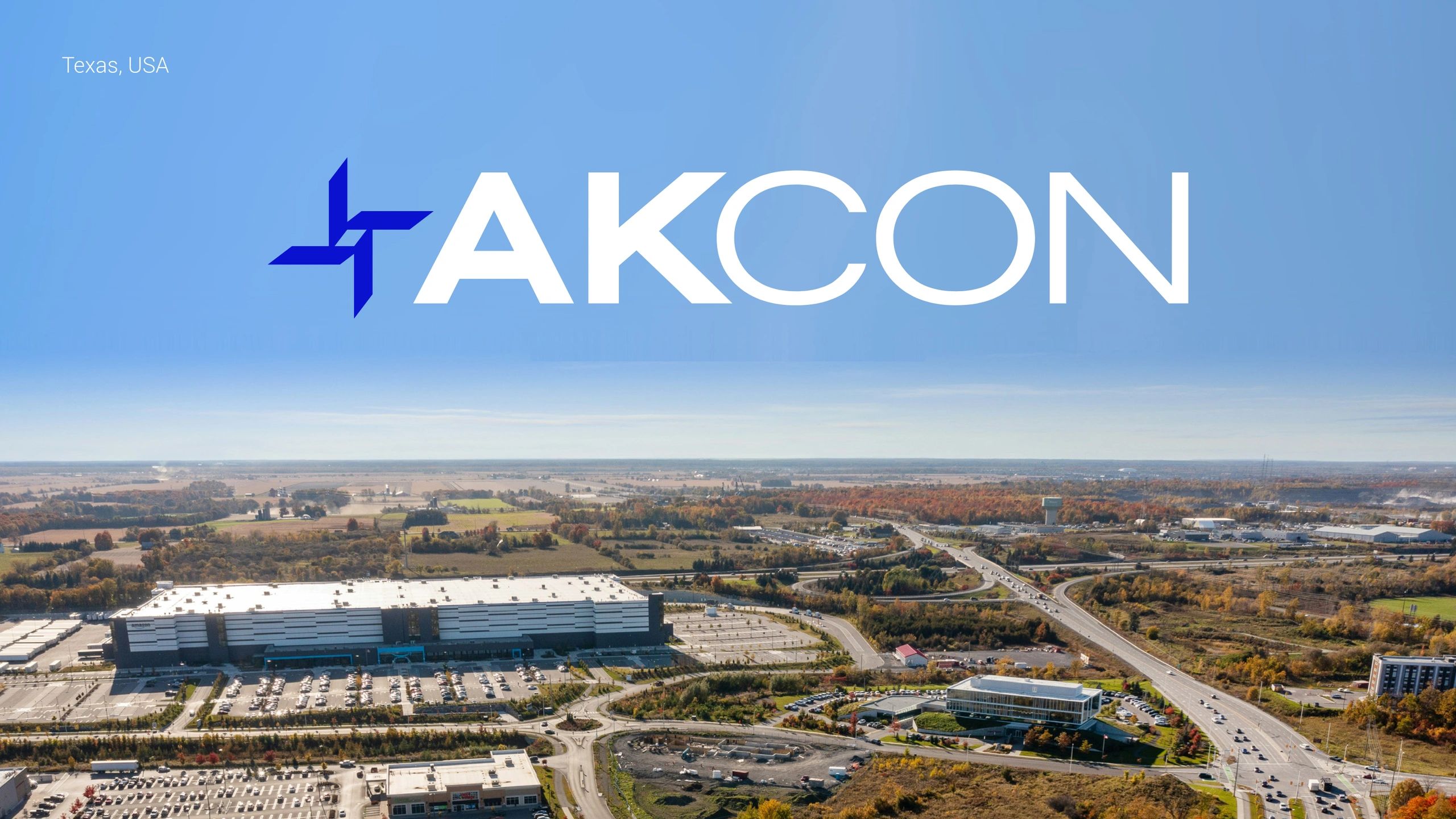 Aerial view of Texas with AKCON logo in the sky.