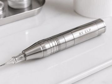 A sleek metallic pen device labeled 'BY ELD' on a clean white surface.