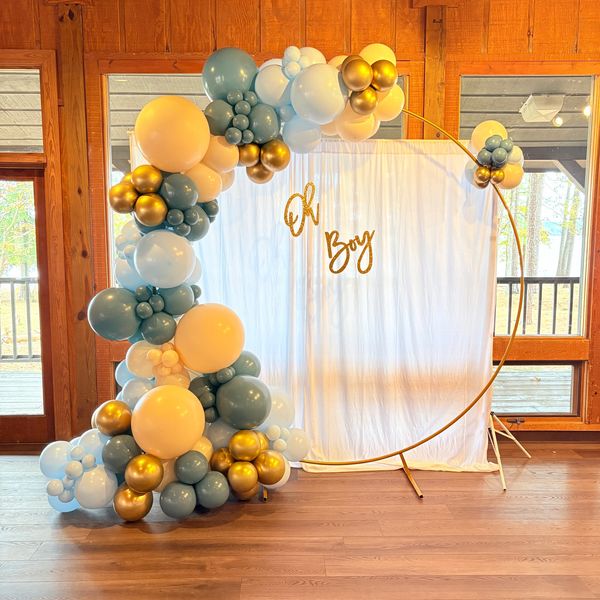 Blue, white, and gold balloon arch for a baby boy event.