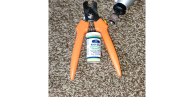 dog nail trimmers, a dremel for nails, and quick stop styptic powder