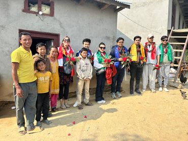 Group photo in village at guest home.