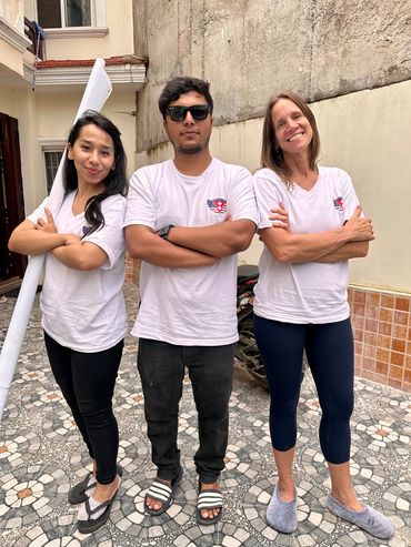 Foundation co-founder and volunteer doctor posing with our t-shirts.