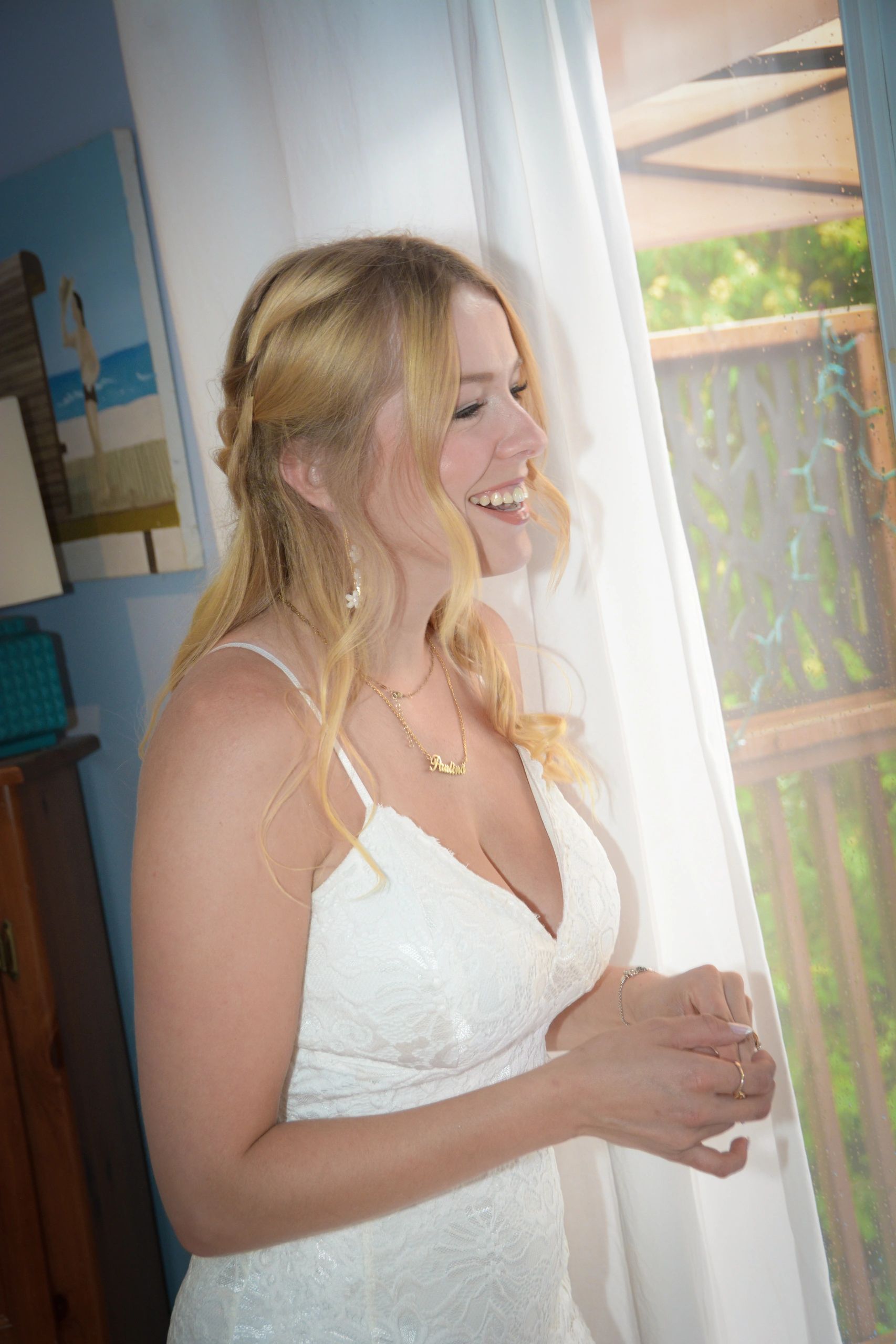 Bride looking out window