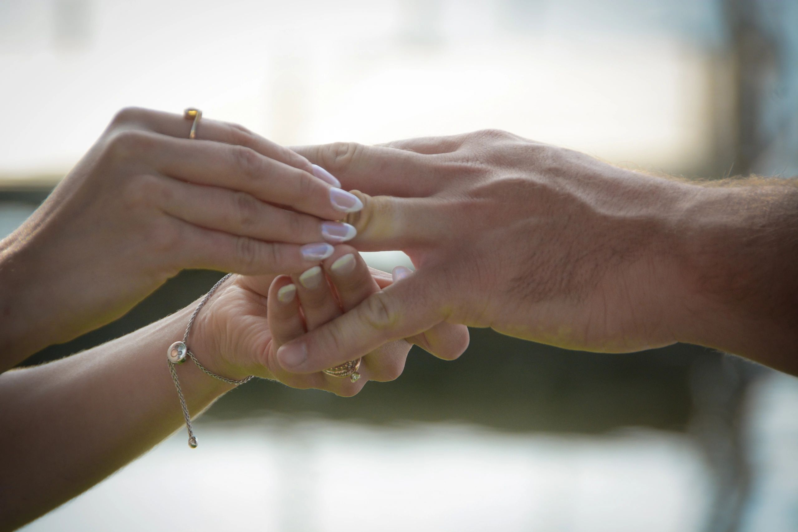 bride giving groom ring