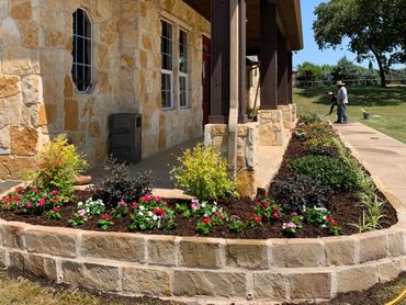 Sandstone flowerbed border , flowers , plants , drainage , soil , mulch installation 