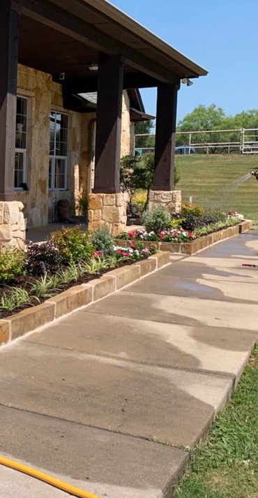 Sandstone flowerbed border , flowers , plants , drainage , soil , mulch installation 