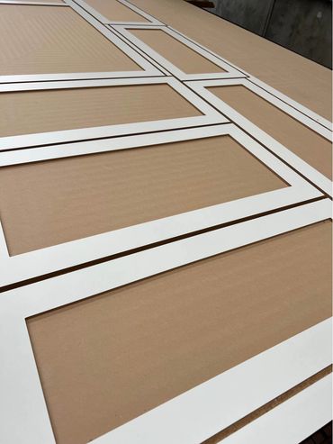 White rectangular frames laid out on a flat surface.