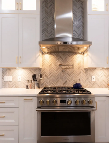 white kitchen cabinet stainless steel hood range