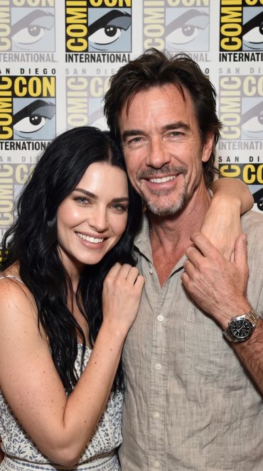 Smiling man and woman posing together at Comic-Con.