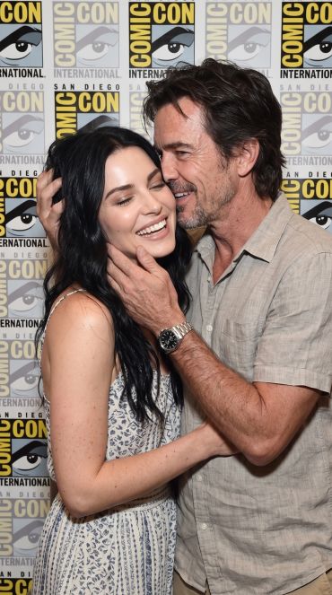 Two people sharing a joyful moment at Comic-Con.