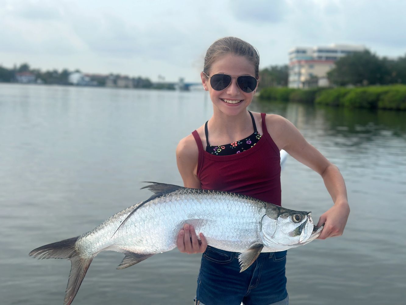 Fishing Charter In Sarasota Florida - Young Angler Lands Her First Tarpon