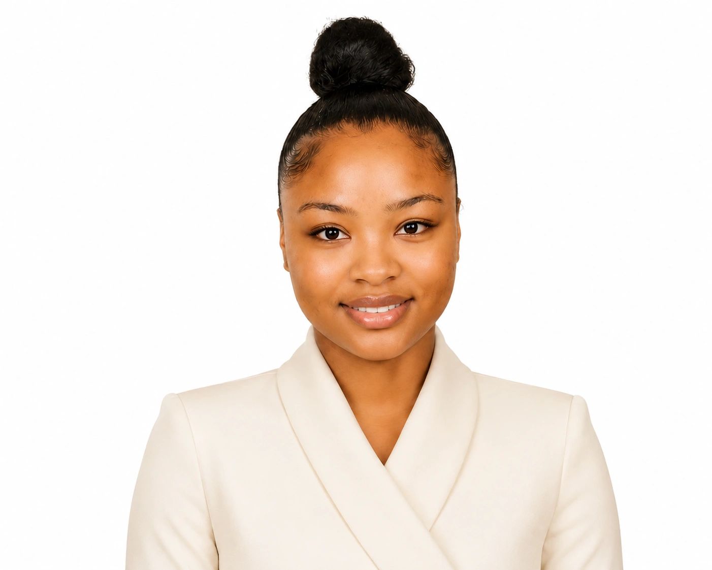 Portrait of a confident woman with a high bun wearing a beige blazer.