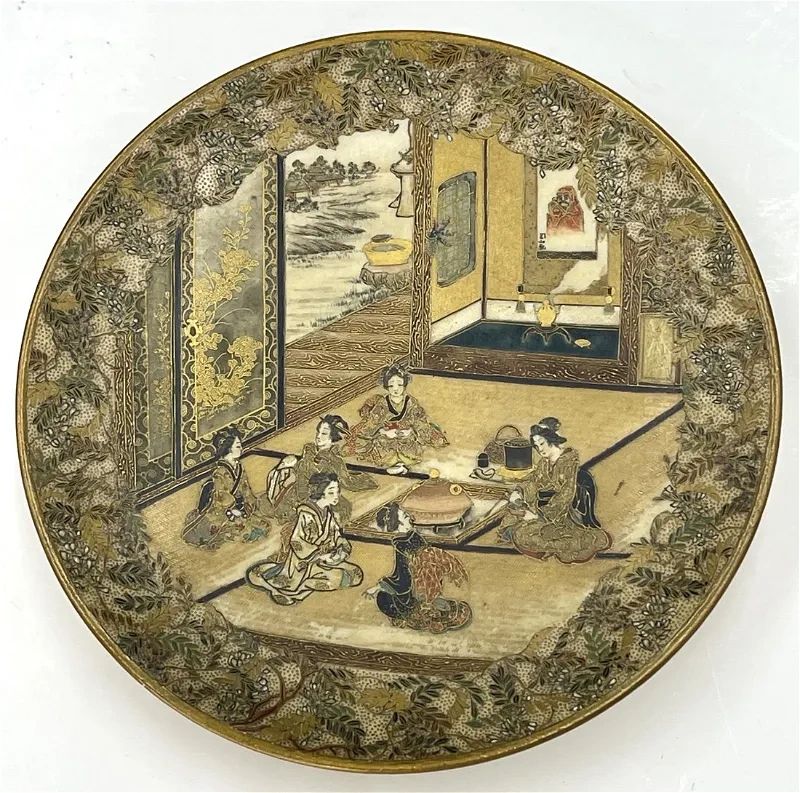 Satsuma saucer dish depicting the Cha No Yu (Way of Tea). Note the signed scroll depiction of Daruma (Bhodhidharma). Shizan Sei seal, Meiji era c.1890