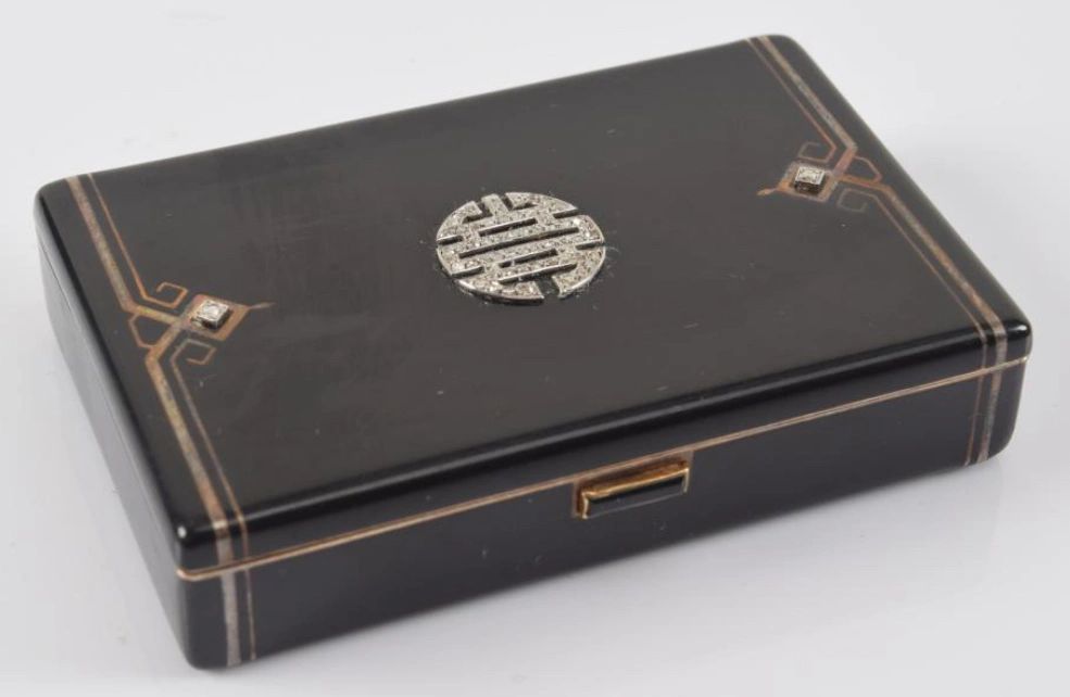 Enamel silver compact with gold accents. Set with diamonds and gold mounted onyx clasp. Cartier France with London 1930 J. Cartier import marks.