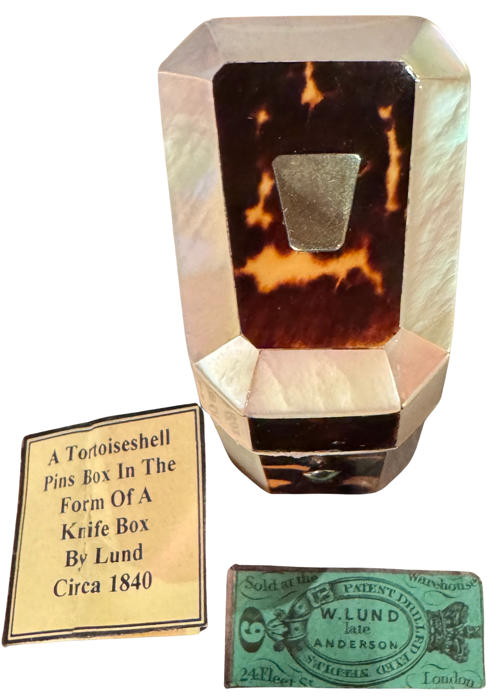 Silver mounted turtleshell and mother of pearl needle box in the form of a miniature knife box with original sewing needle set. Maker - William Lund. London, c.1840