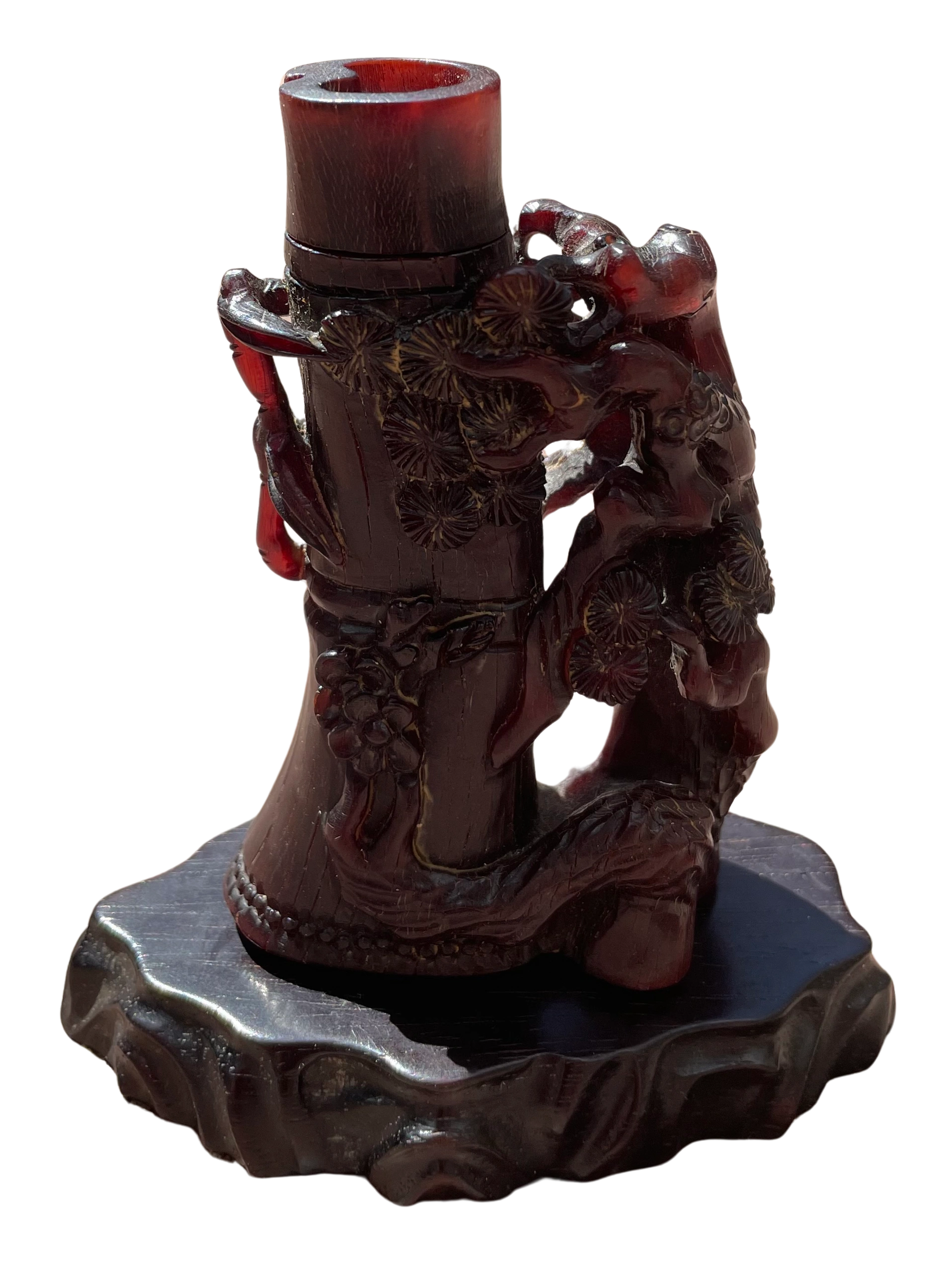 Rhinocerous horn snuff or medicine bottle modeled as a burled tree trunk with plum blossom clusters. Qing dynasty.
