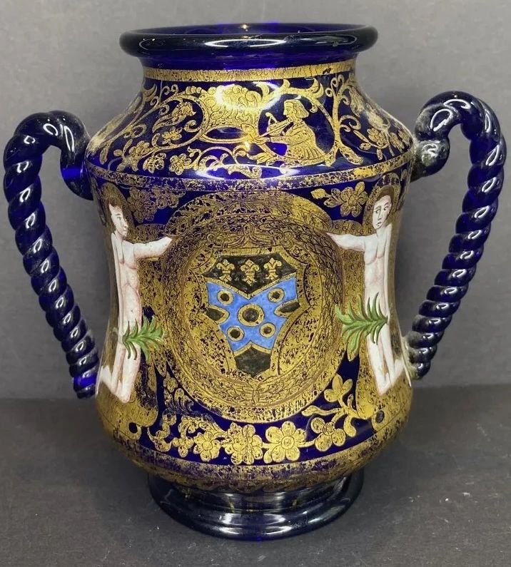 The Medici Cup. Enameled glass bearing the Arms of Medici and depictions of Adam & Eve, likely commemorating the coronation of Charles IX, son of Catherine de Medici, in 1561. Note the vignette of Andrea Amati (1505-1577) - luthier and progenitor of the four stringed violin. Note: the Medici armorial balls are black, not red, as per Catherine de Medici’s order that the Medici balls be black, in mourning for her husband, Henry II.