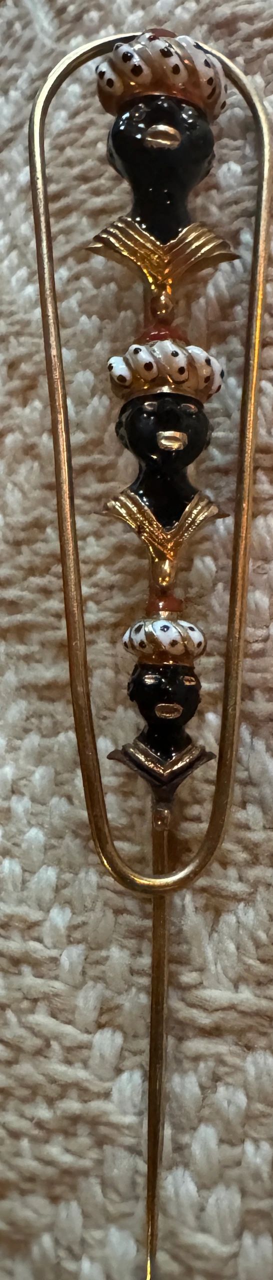 Blackamoor pin, enameled on gold, set with diamonds & coral. Cartier, Paris, c.1930