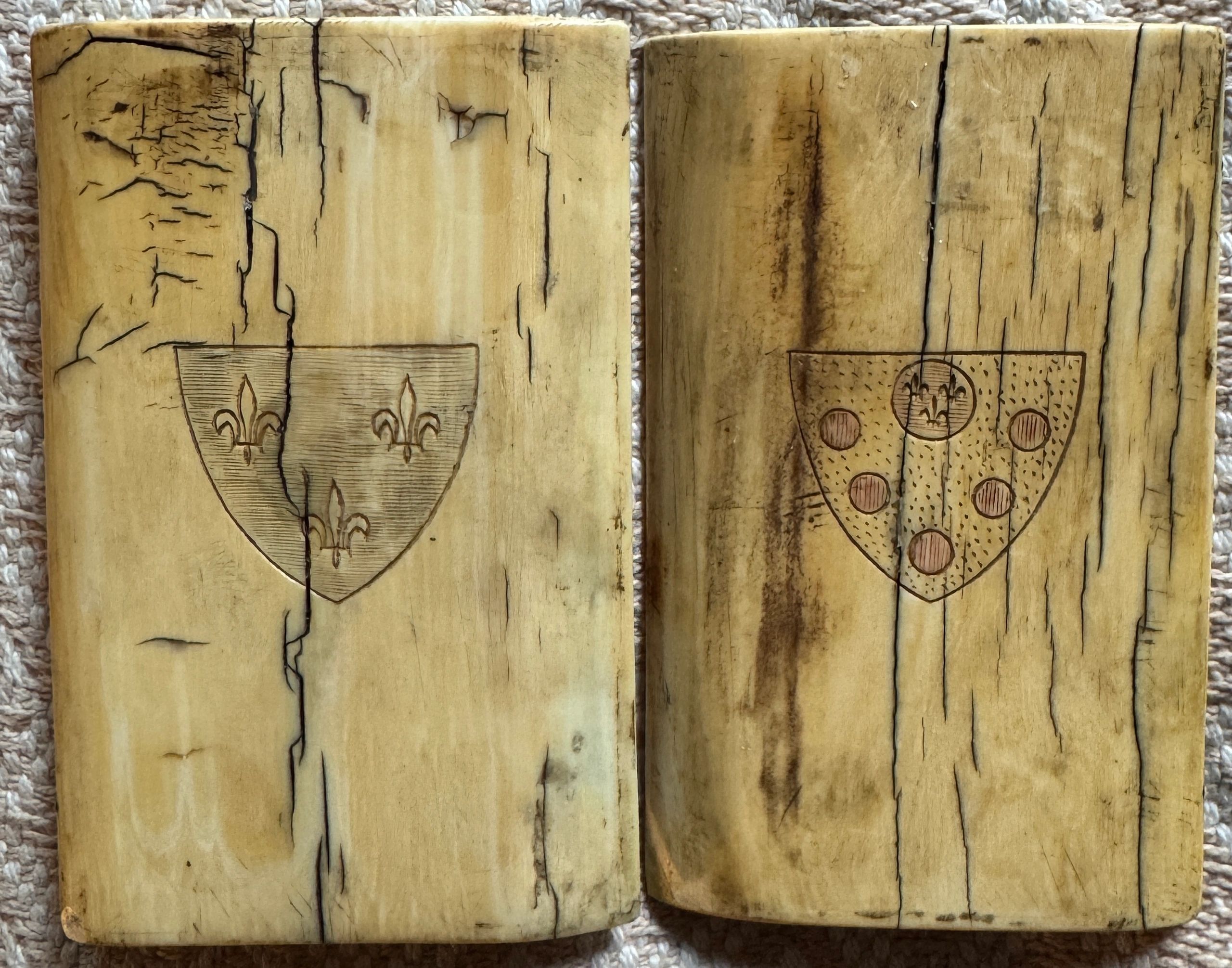 Front view of mammoth ivory diptych showing arms of Henri IV & Marie de Medicis.