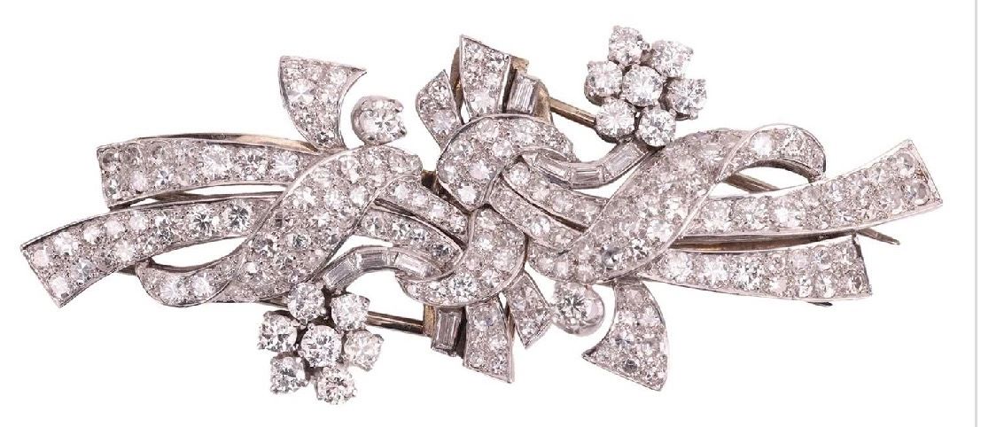 Platinum clip pins (duette brooch) set with diamonds. Raymond c.Yard, c.1945.