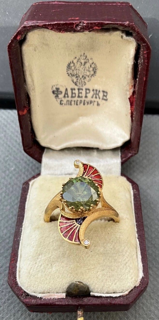 ’Fauvist’ style ring set with a 3 carat demantoid garnet, 2 diamonds and enamel decoration. St. Petersburg gold mark for 1908-1917 and original Imperial Russian presentation box.