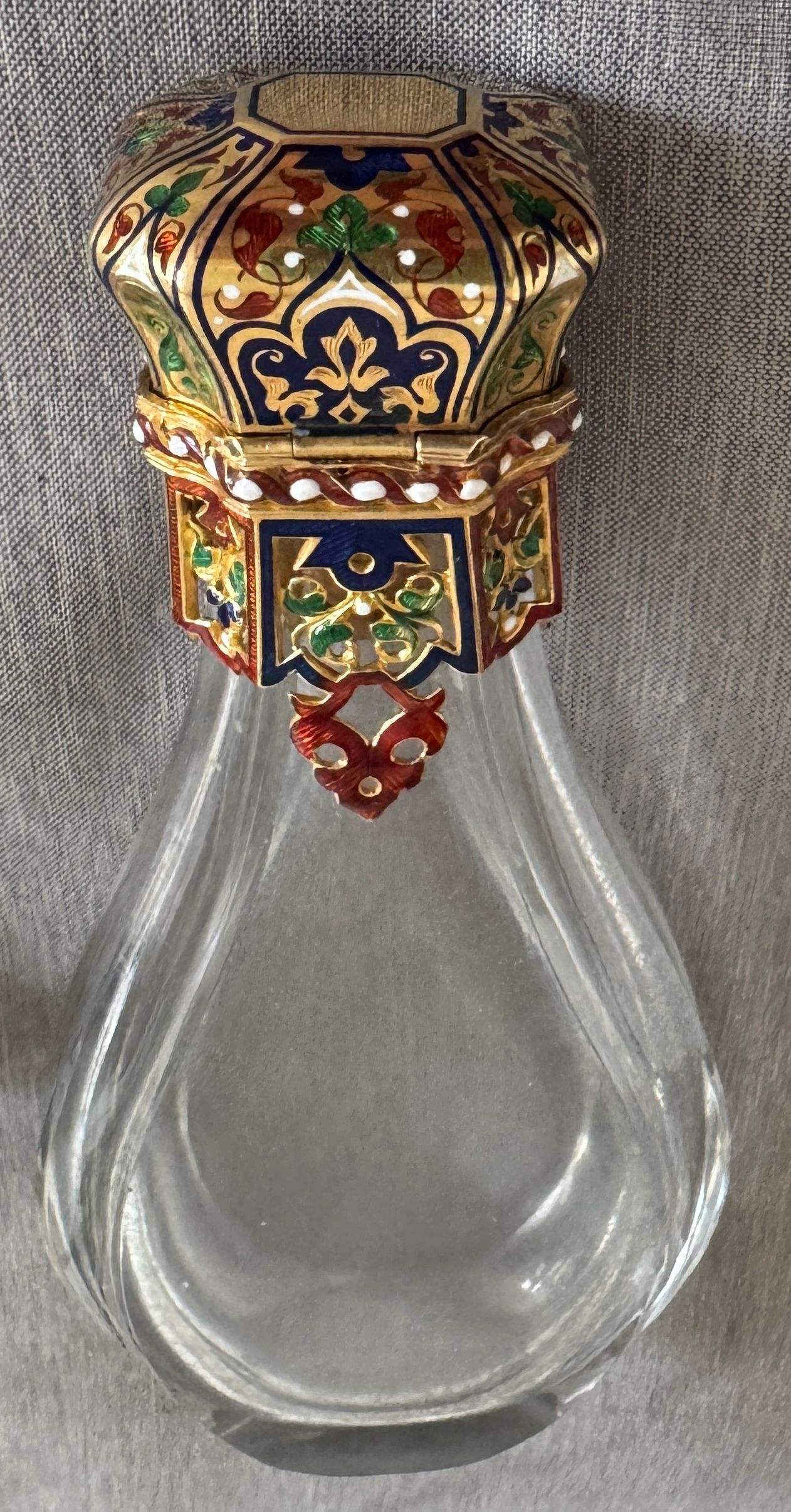 Crystal scent bottle with champleve enameled gold closure and taille d’epargne enameled stopper. Swiss c.1820