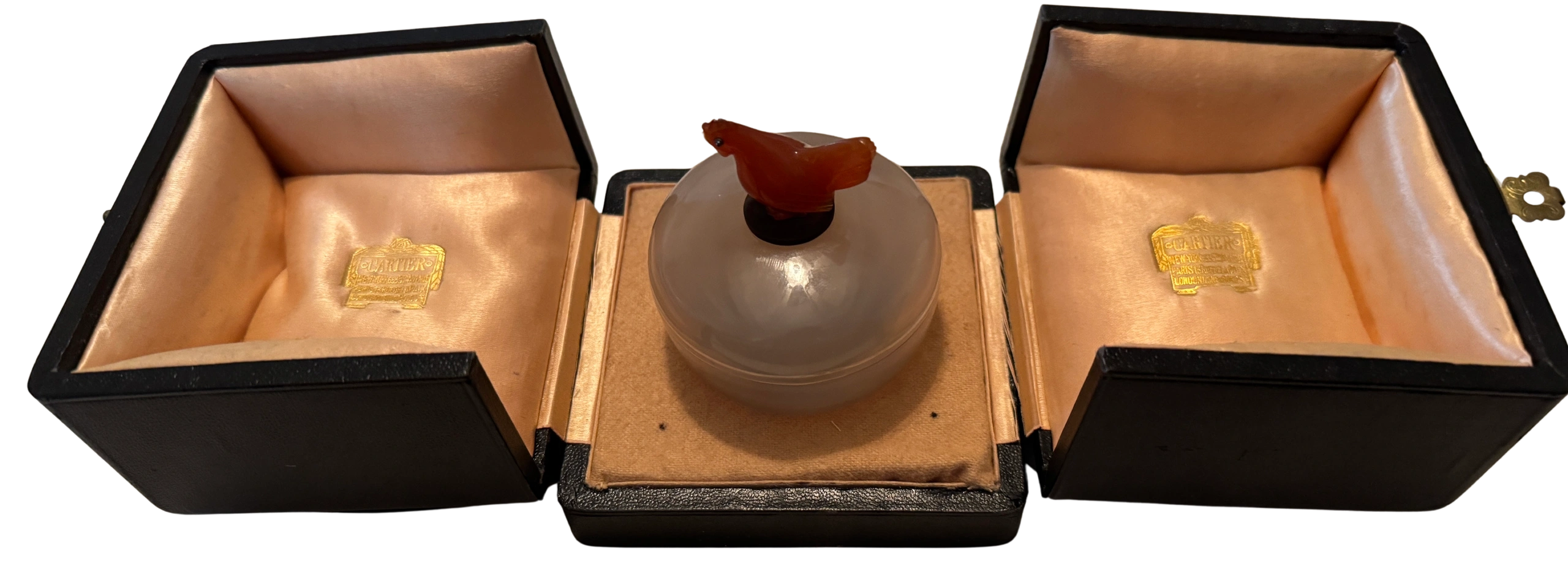 Antique Chinese chalcedony seal paste box set on an enameled gold & silver base, the lid topped by a carnelian red rooster with cabochon sapphire eyes. Work master Paul Pillard for Cartier, c.1930.