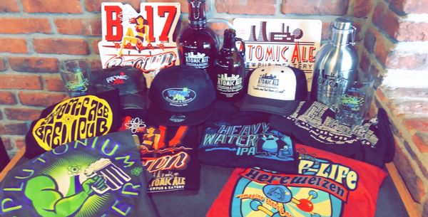 T-shirts, hats, and metal signs