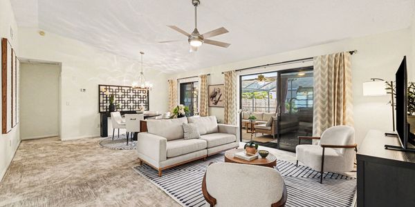 Bright and cozy living room with sliding glass doors.