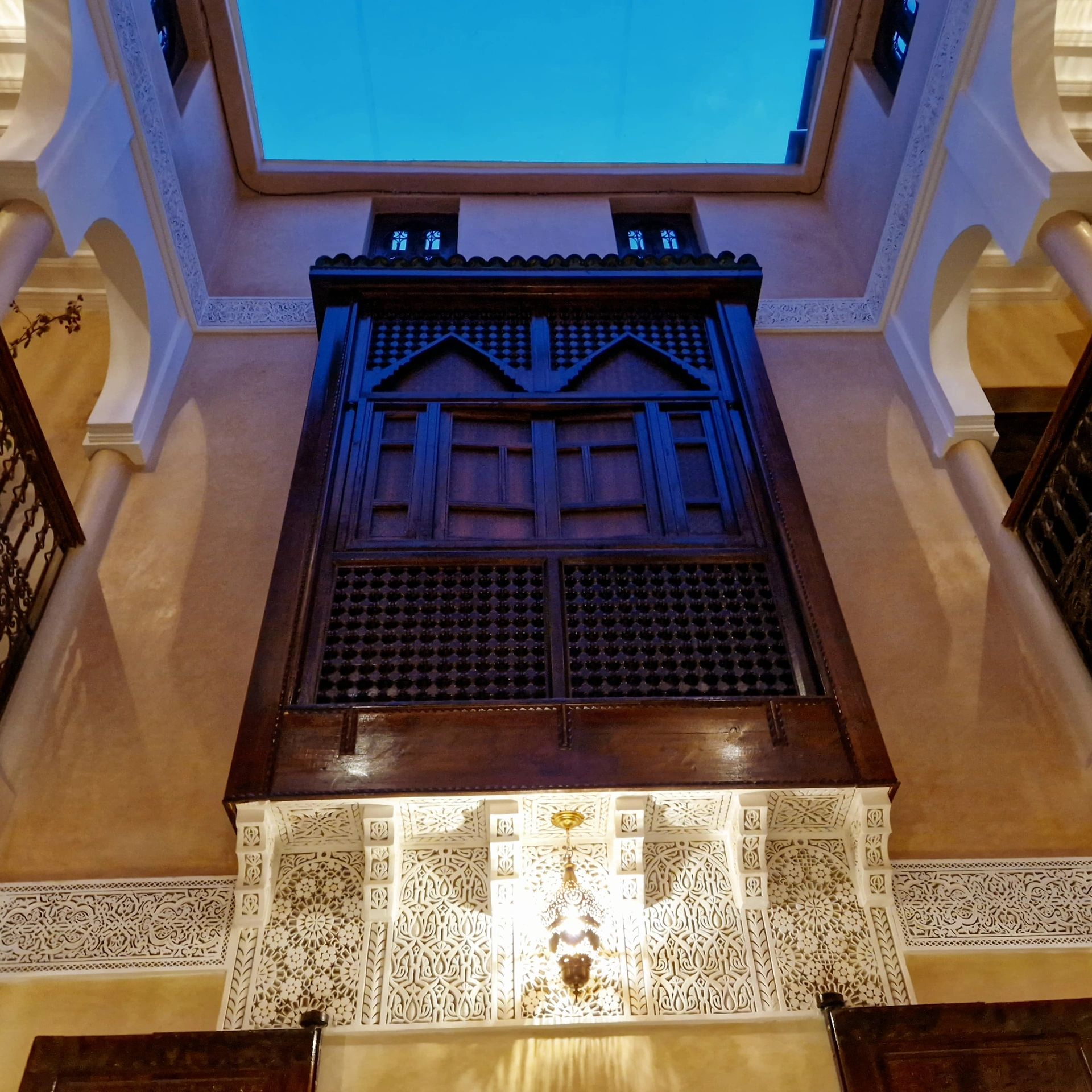 Surrounded by the beauty of traditional Moroccan architecture, lush greenery,