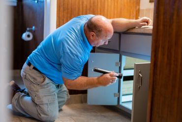 Checking the plumbing for any leaks or issues with drainage. Lake Martin Inspections