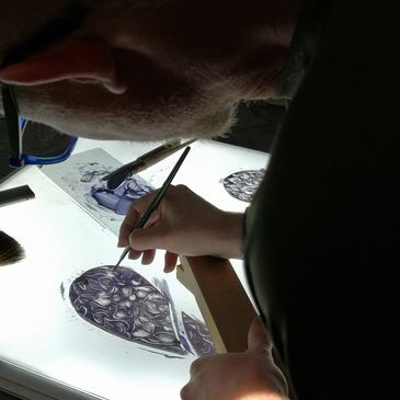 Glass painting flowers for a stained glass windo