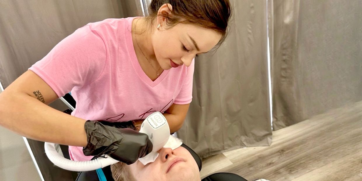 Kailee performing laser hair removal on a male patient