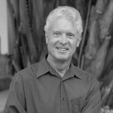 Smiling older man in button-up shirt