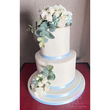 Pale blue and white wedding cake