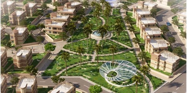 Aerial view of a modern residential neighborhood with greenery and pathways.