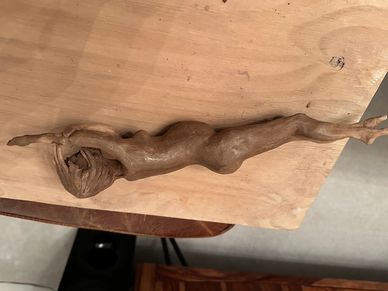 Clay women in pregnant repose