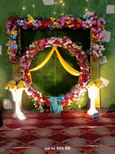 Decorative floral frame with lights for a celebration.