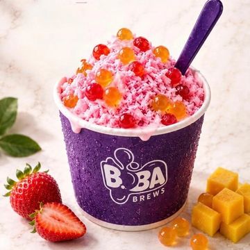 Colorful boba dessert with fruit toppings and a purple cup.