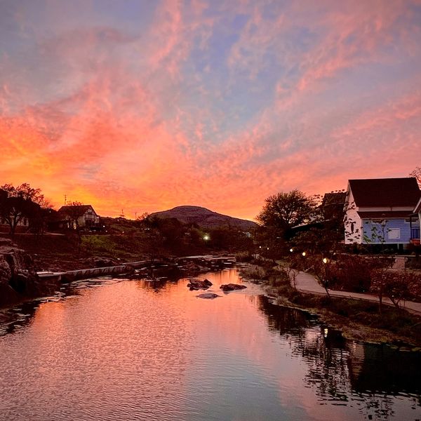 Photo of a river at sunset.