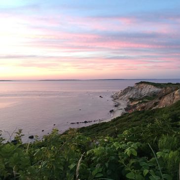 sunset on the cliffs of a beach