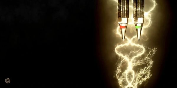 Two glowing pen tips with electric-like light trails against a dark background.